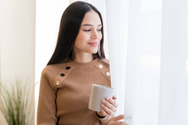 istock Young woman with cup of coffee 1467467982