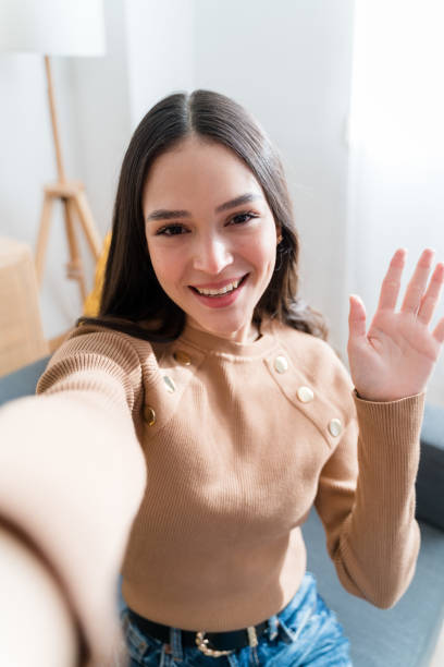 istock Happy woman having a videocall at home 1467469863