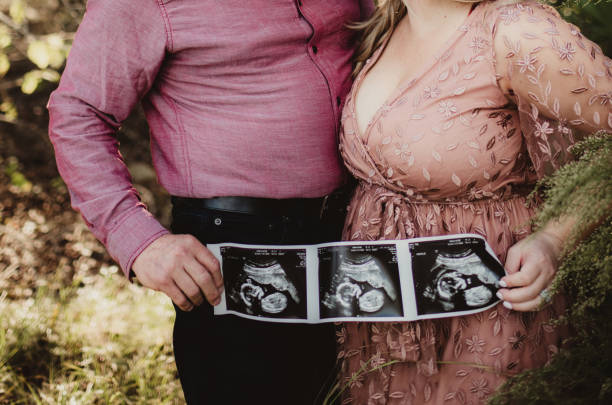 istock Couple holding ultrasound photos 1467472227