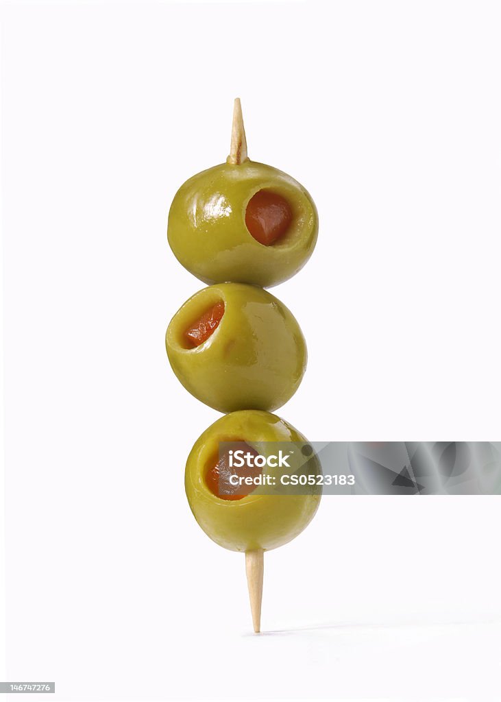 Olive tower. Three olives on toothpick Olive - Fruit Stock Photo