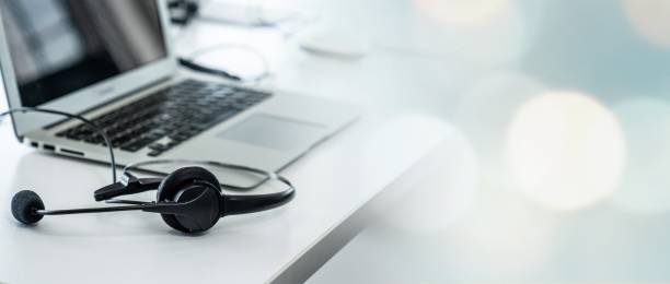 istock Headset and customer support equipment at call center ready for actively service . Corporate business help desk and telephone assistance concept . 1467475362