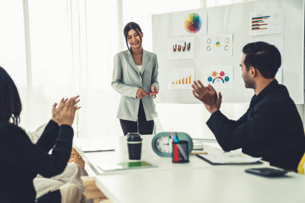 istock Businesswoman proficiently present work project receive celebrations from team . Corporate business team collaboration concept . 1467479420