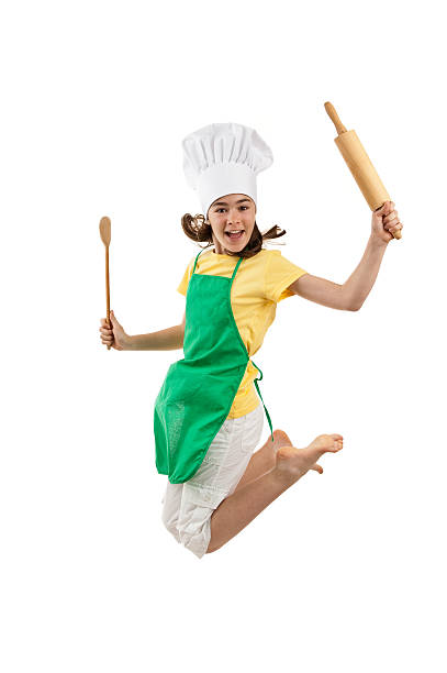 istock Young girl with spoon and rolling pin jumping with joy 146748061