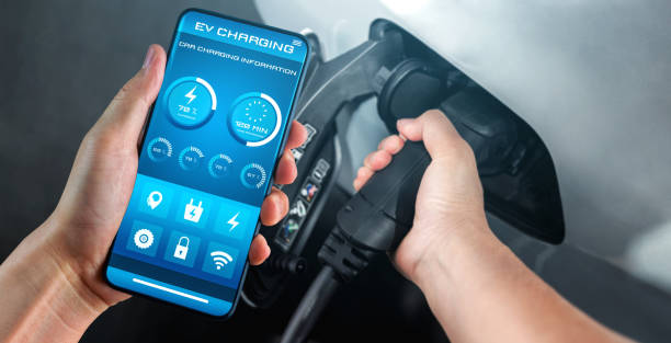 EV charging station for electric car with mobile app display charger status . The electric power is produced from sustainable resources to supply to charger station in order to reduce CO2 emission . estación de carga ev para coche eléctrico con estado del cargador de pantalla de aplicación móvil. la energía eléctrica se produce a partir de recursos sostenibles para suministrar a la estación de carga con el fin de reducir la emisión de co2.