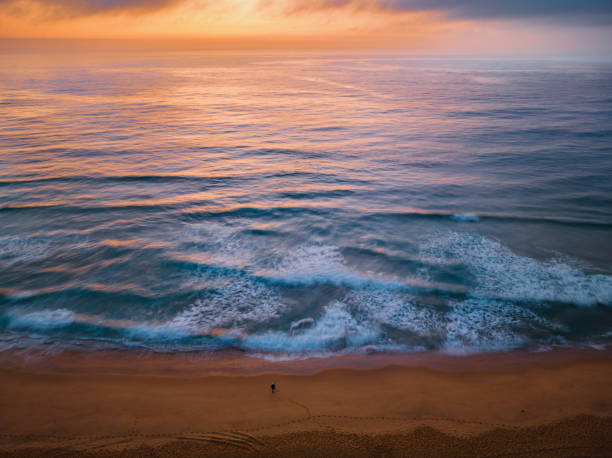 istock Summer sunrise at the seaside with clouds and haze 1467486182