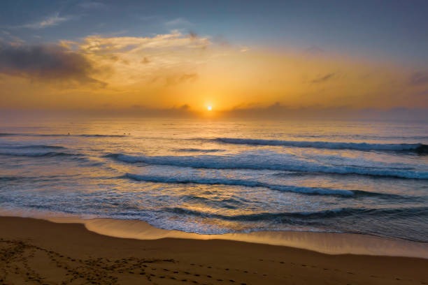 istock Summer sunrise at the seaside with clouds and haze 1467486183