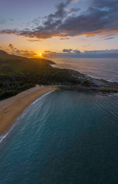 istock Rain cloud sunrise over the beach and mountain 1467486577