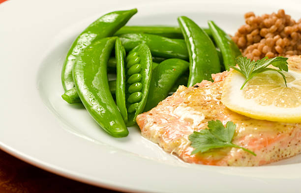 Salmon with Peas and Israeli Couscous stock photo