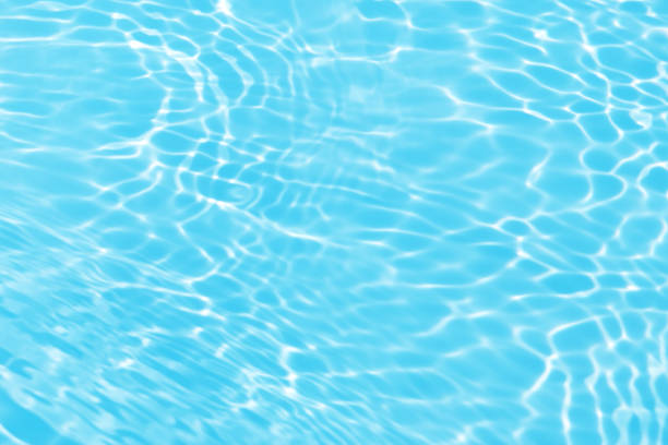 istock Defocus blurred transparent blue colored clear calm water surface texture with splashes and bubbles. Trendy abstract nature background. Water waves in sunlight with copy space. Blue watercolor shining 1467494008
