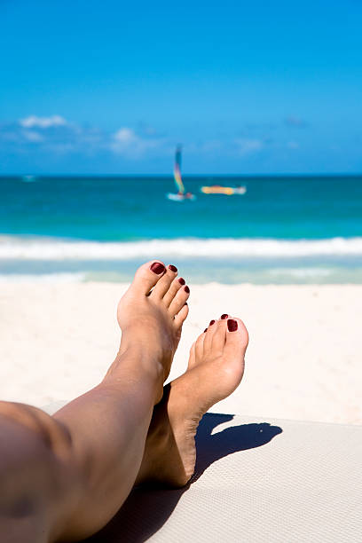istock Woman's legs on a beach chair  146750020
