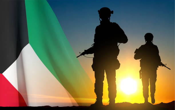 istock Kuwait flag and the silhouettes of a soldiers 1467506532
