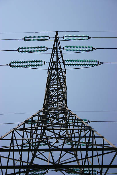 High tension wires and tower stock photo