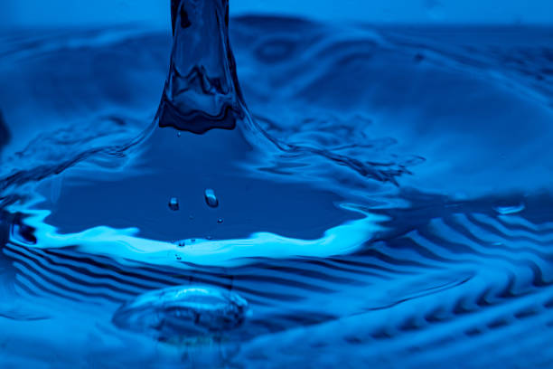 istock water drop splash in blue glass 1467508099