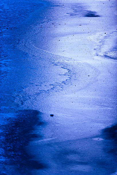 Curved shape on icy lake stock photo
