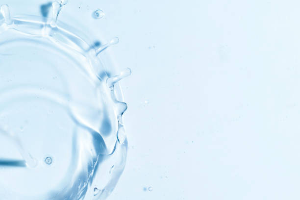 Close-up of fresh and transparent splashes of water or lotion, micellar in the form of a crown stock photo