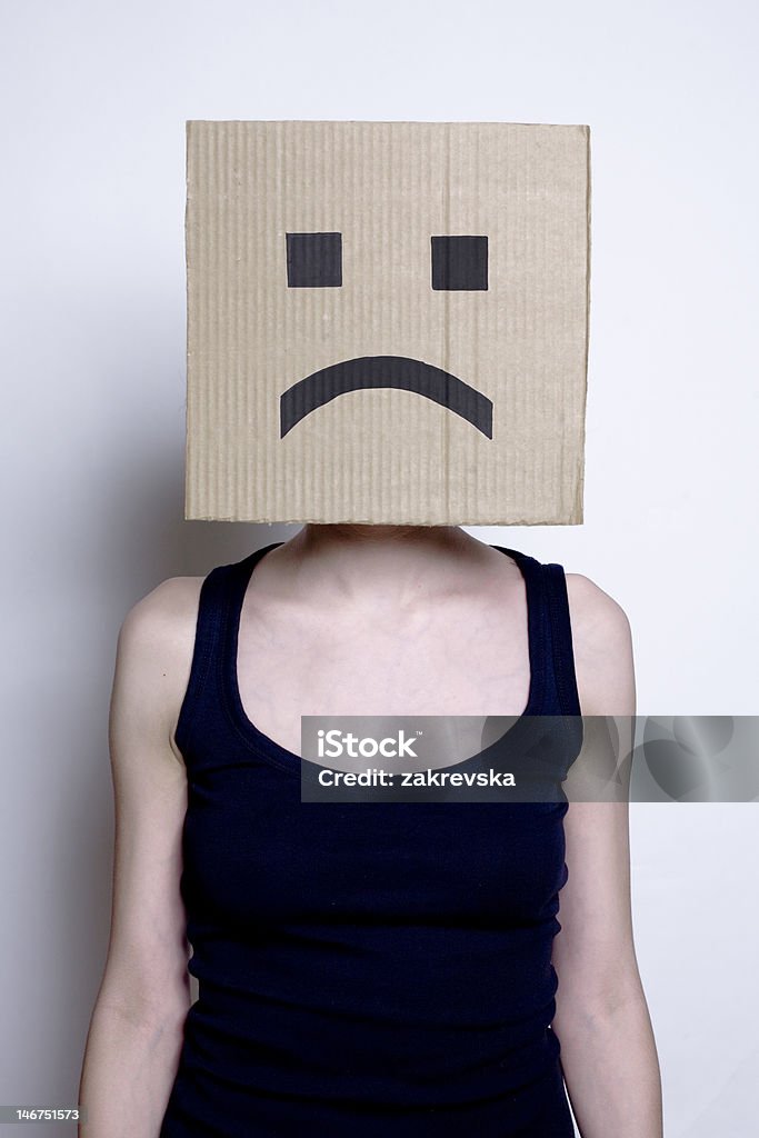 sad smile girl in mask with sad smile Artificial Stock Photo