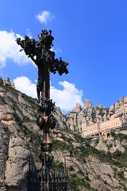 istock Monumental cross sculpture and Montserrat monastery (Catalonia, 146752182