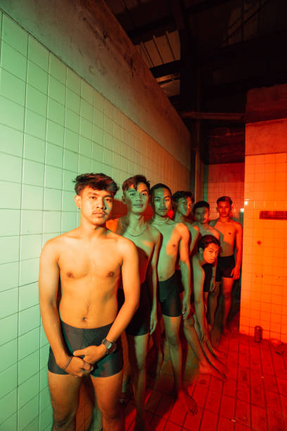 a group of naked gays standing with their friends in a bathroom a group of naked gays standing with their friends in a bathroom at night transgender protest stock pictures, royalty-free photos & images