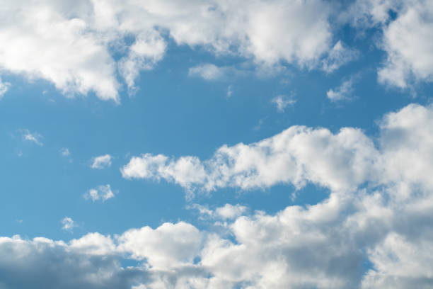 White clouds and blue sky background stock photo