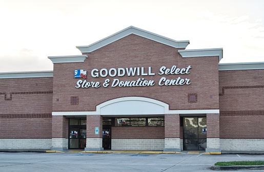 Houston, Texas USA 11-11-2022: Goodwill Select storefront and parking lot in Houston, TX. Non-profit organization founded in 1902.