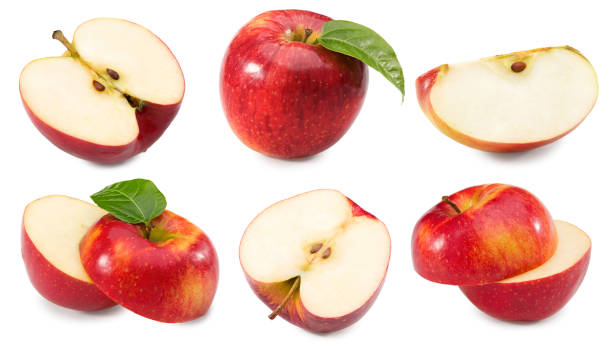 istock red apples with green leaf and half isolated on white background. clipping path. 1467524314
