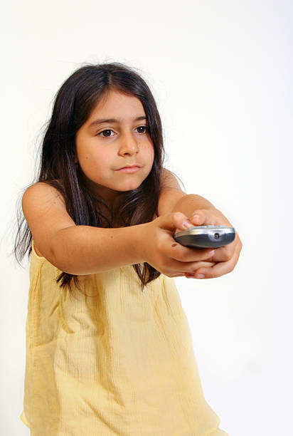 Girl with remote stock photo