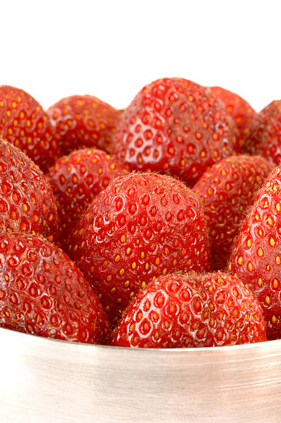 Strawberries close up in a metal bowl stock photo