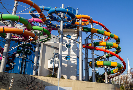 Krakow, Poland - March 21, 2022: Water slides tubes at Aqua Park in Kraków (Park Wodny w Krakowie) swimming hall with pools and sauna area.