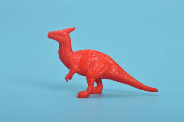 istock Parasaurolophus dinosaur toy model isolated on a blue background 1467539259