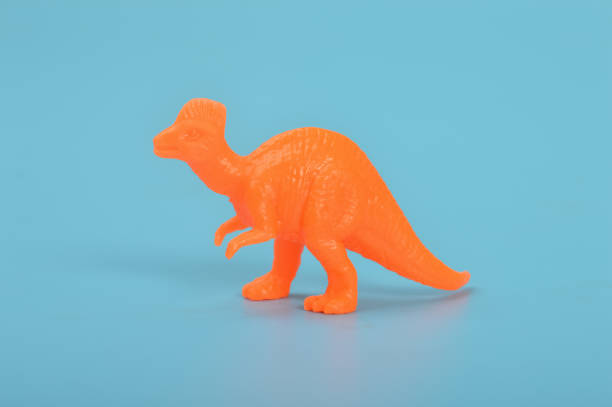 istock Corythosaurus dinosaur toy isolated on a blue background 1467539283