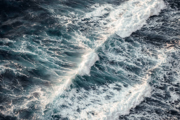 Powerful ocean waves rushing to meet the coastline