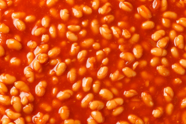 istock Baked beans on toast in tomato sauce on white plate 1467544495