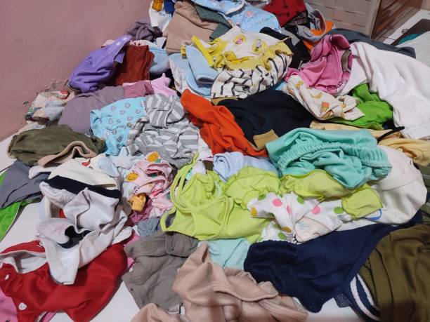 istock Messy children's clothes on the floor 1467544754