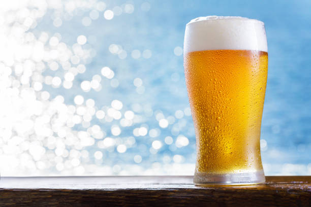 glass of beer on  background of the sea stock photo