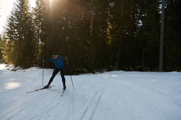 istock Nordic skiing or Cross-country skiing classic technique practiced by man in a beautiful panoramic trail at morning.Selective focus. 1467547536
