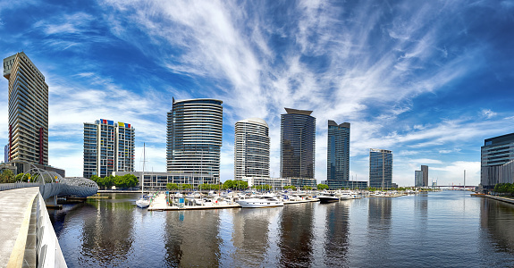 Melbourne cityscape and marina. A panorama of modern architecture and moored pleasure boats.
