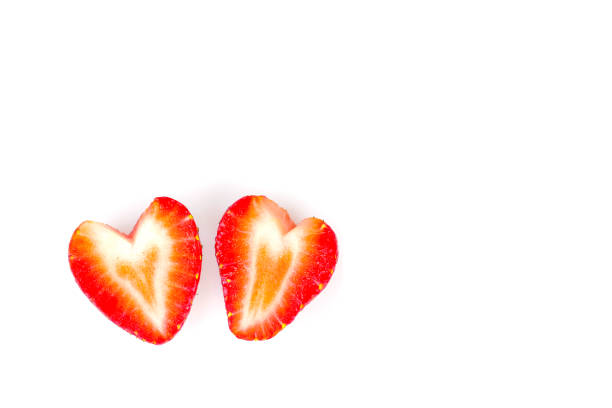Heart shaped strawberry isolated on white background