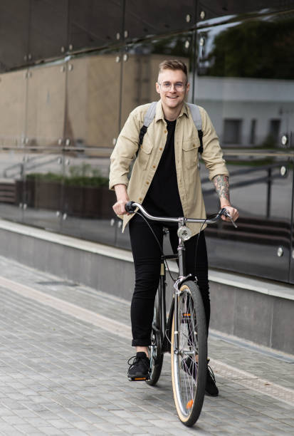 istock Handsome young man with bicycle in a city 1467553186