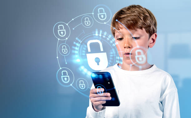 Kid boy with phone, cybersecurity hologram and padlock circuit stock photo