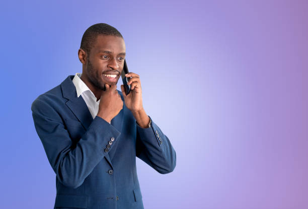 istock Black businessman calling on the phone, gradient copy space background 1467560538