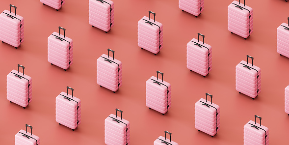 3D rendering of from above of bright pink suitcases placed in row against pink background, isometric view