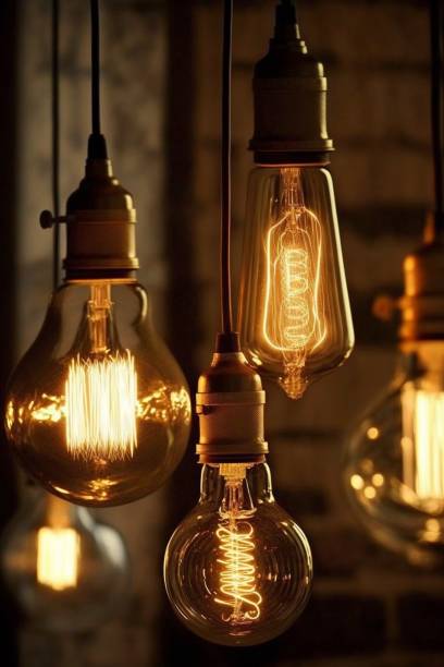 istock Decorative antique Edison style filament light bulbs glowing in the dark 1467565174
