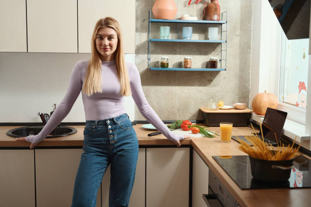 istock Housewife posing for the camera while cooking spaghetti 1467572305