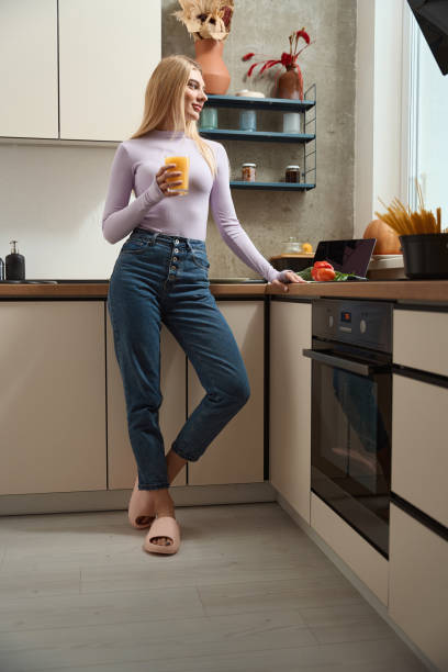 istock Dreamy woman with citrus drink in hand 1467572309
