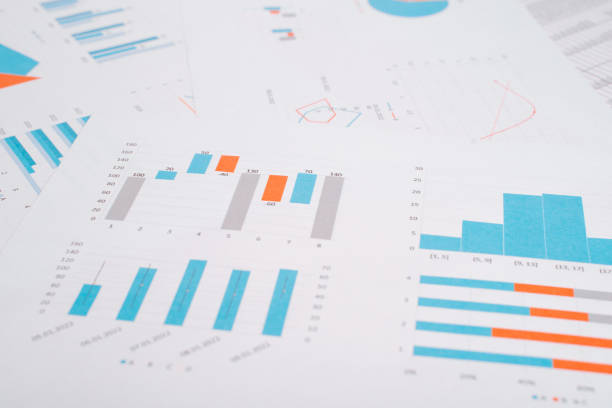 istock Business documents, financial papers with graphs and charts on the desktop. Low angle view, selective focus 1467573204