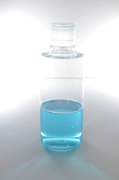 istock a Blue alcohol sanitized bottle on white background. 1467574369