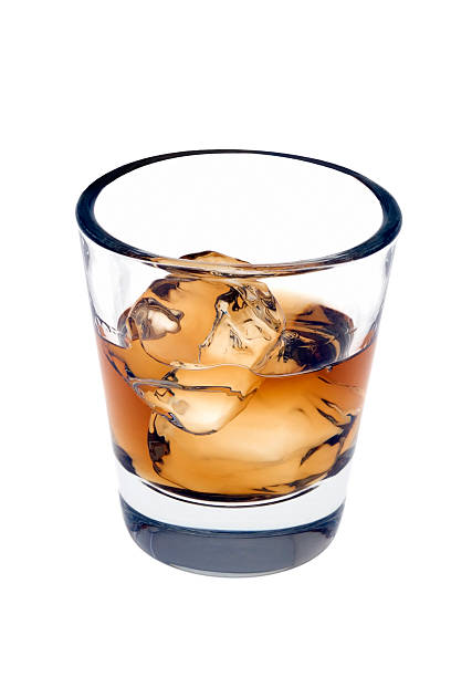 Whiskey over ice on a white background stock photo