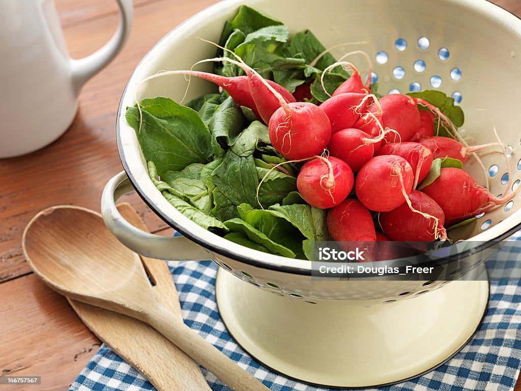 Fresh picked and washed Radishes Country Kitchen Colander Stock Photo