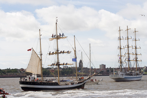 Tall ships leaving in the Mersey at the beginning of the race