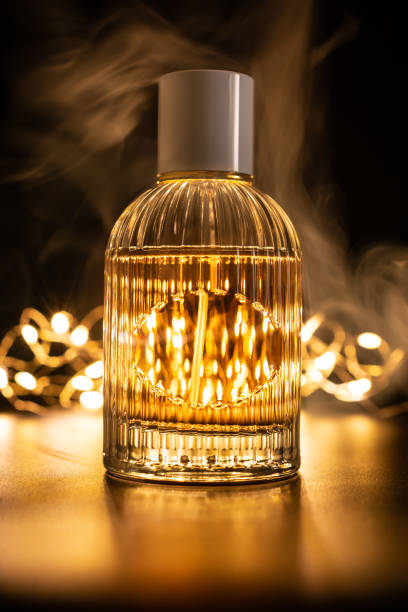 istock Glass bottle of perfume with smoke 1467577816